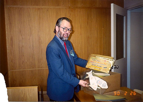 Clive Phillpot handling some of Picasso's works and materials in The Museum of Modern Art Library New York, 1990.