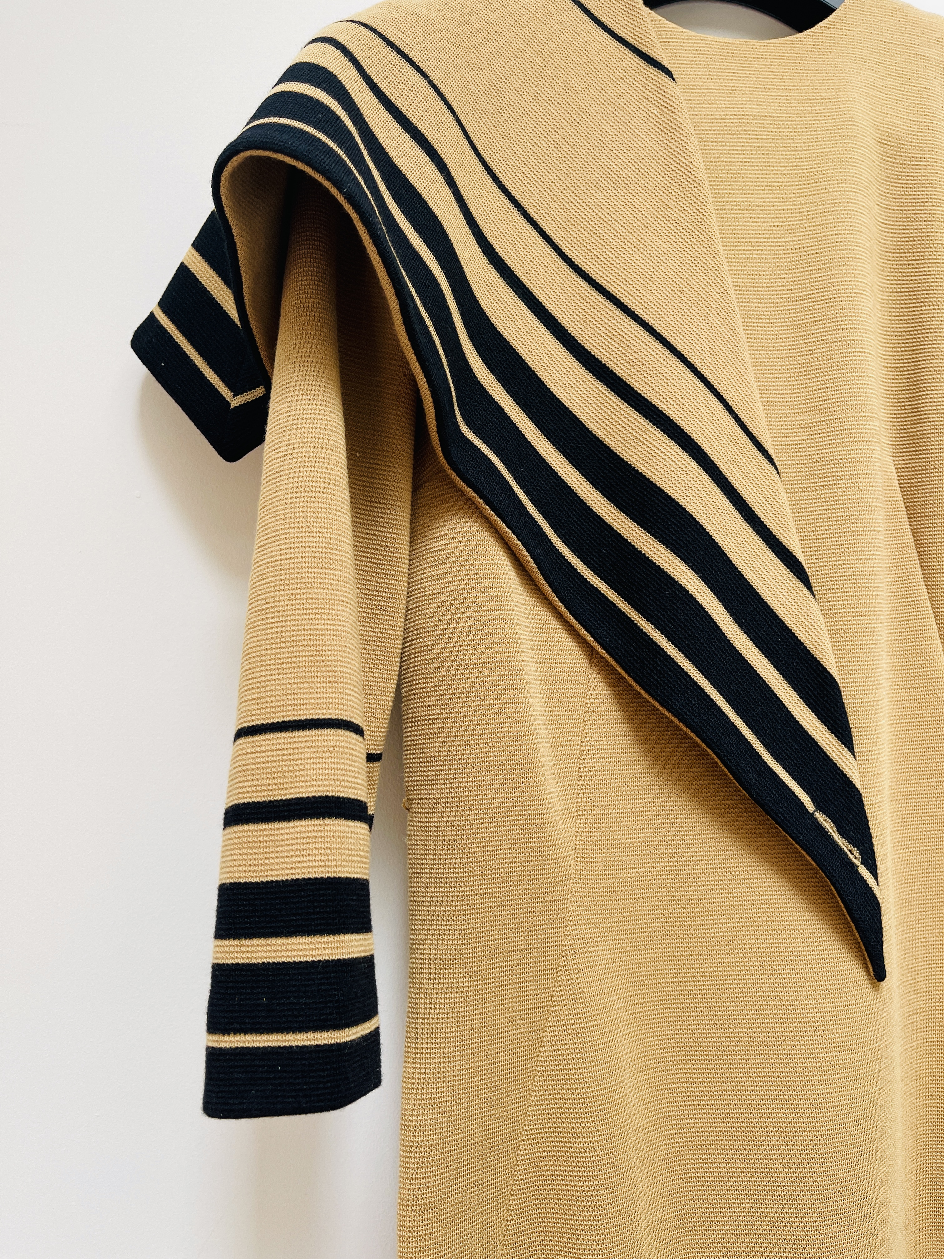 beige jumper with diagonal stripes