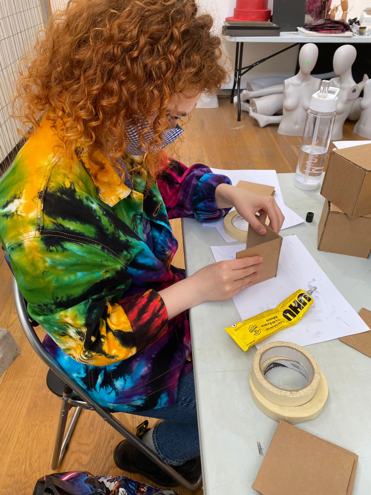 student working with glue