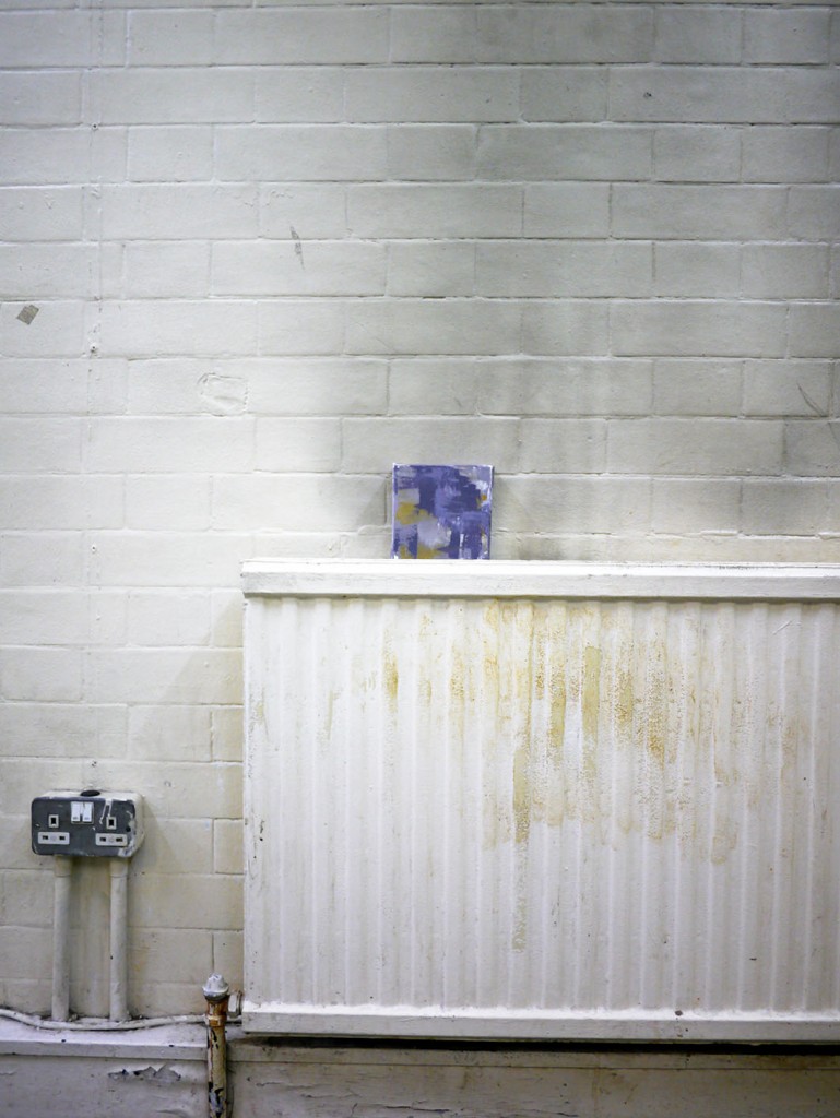 BA Drawing students external exhibition at Hotel Elephant. Image of small tile painting in situ on radiator 