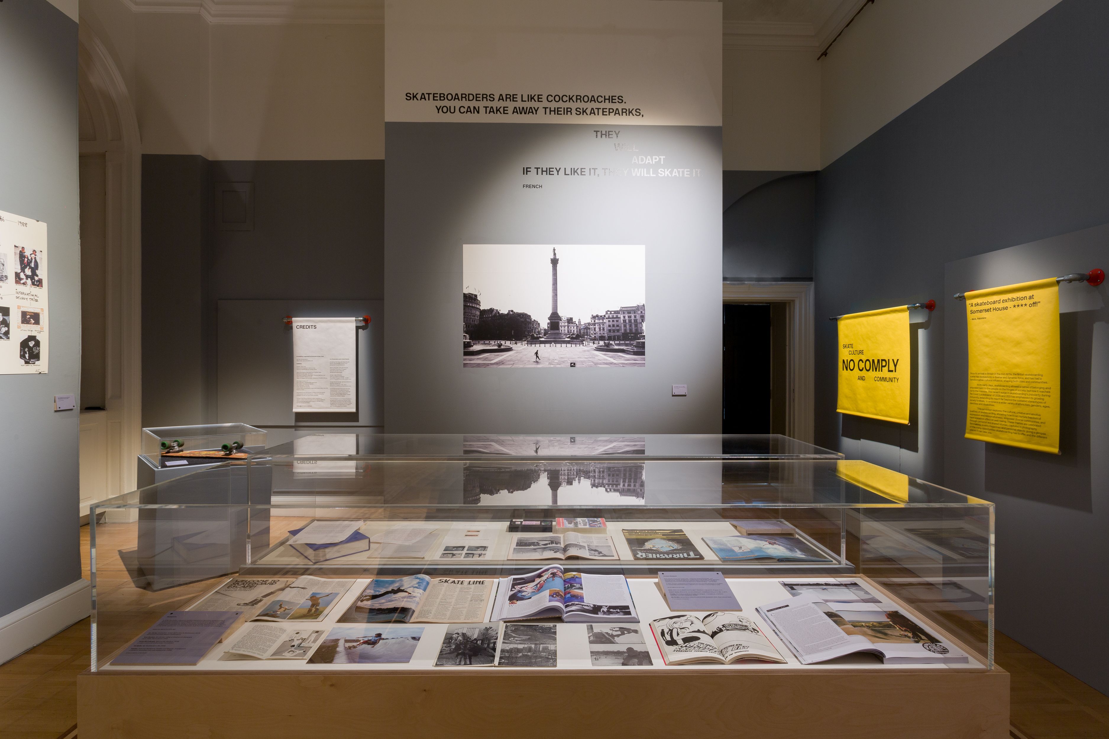 exhibition display of documents in glass case