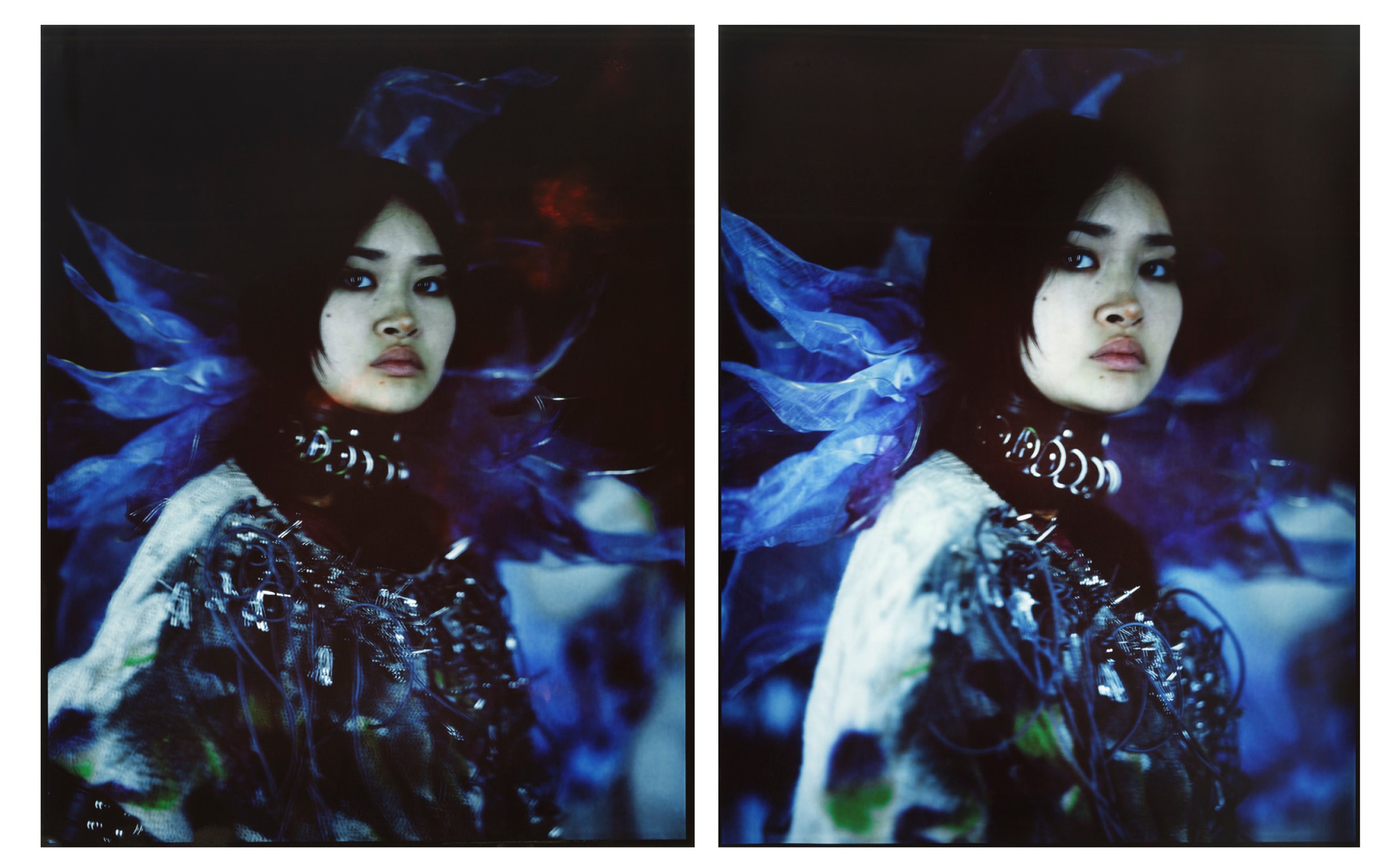 Model posed in front of printed fabric