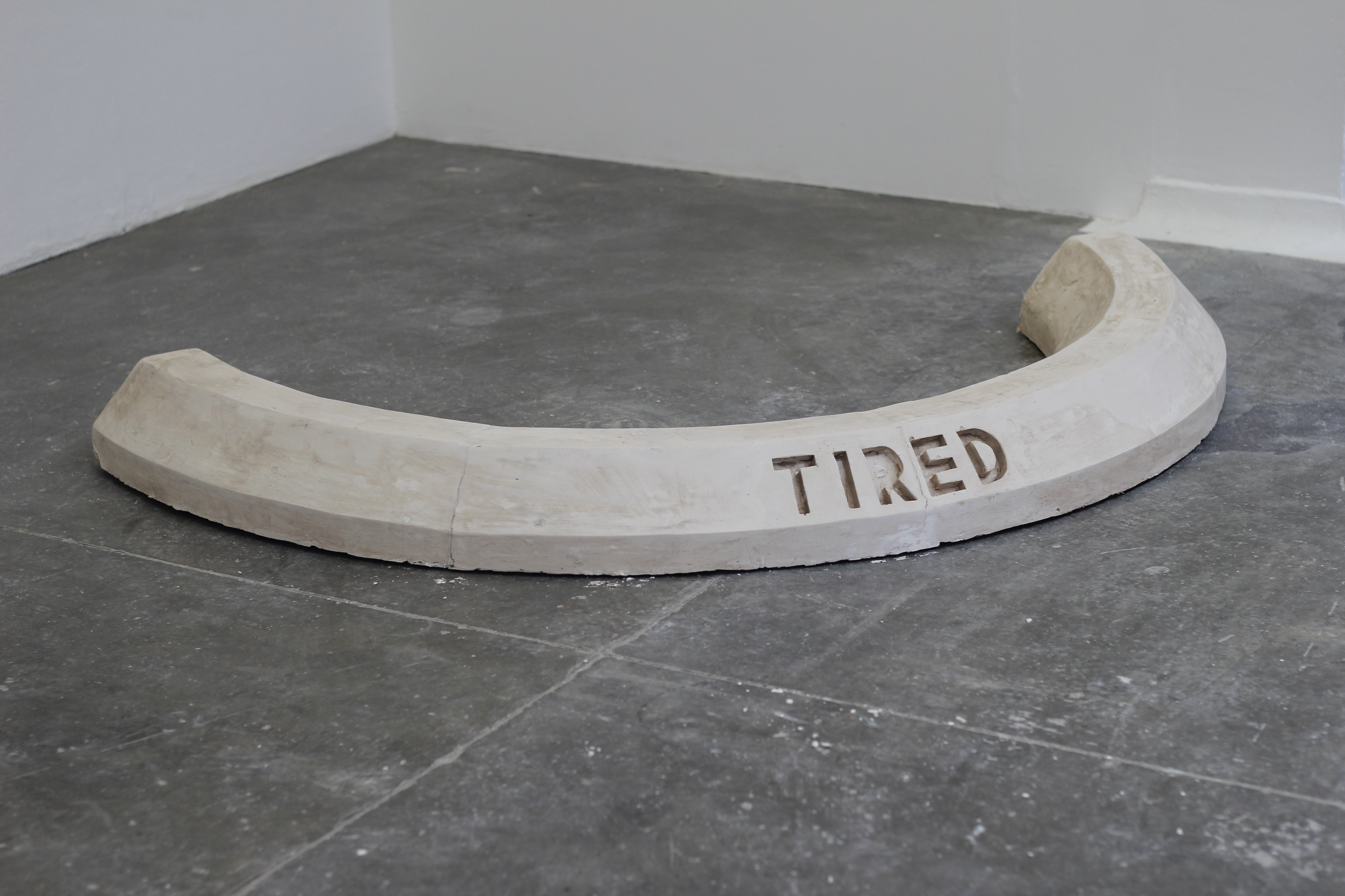 Parking kerb Sculpture 'Tired' by Josh Philpott