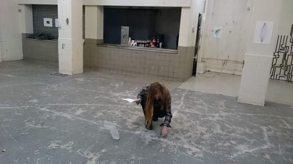 Zuzanna Pedrasik - BA Drawing students external exhibition at Hotel Elephant. Student creating written text of floor of exhibition space