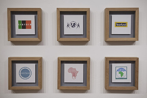 ogos of Non Profit Organisations working in Kenya (some of which are imaginary) : installation, silk screen, 80 x 230 x 5 cm each [6 of 24], 2010, ongoing, © Sam Hopkins