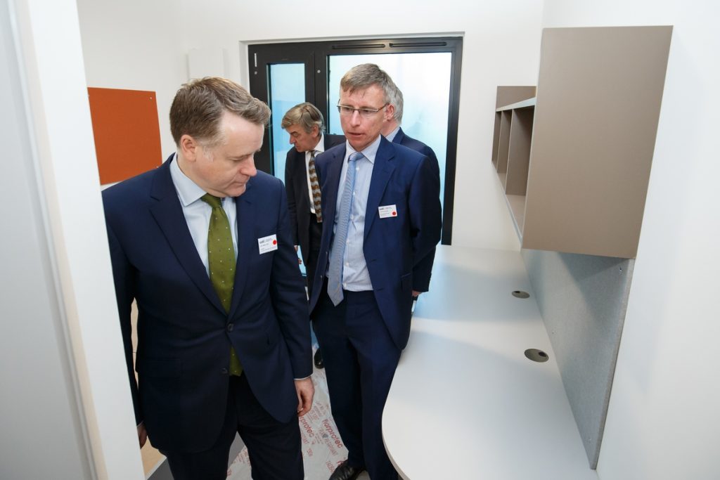 Leader of Southwark Council, Pete John OBE and Justin Elcombe, Managing Director of developers Hollybrook, explore a room in the new student accommodation block at Camberwell.
