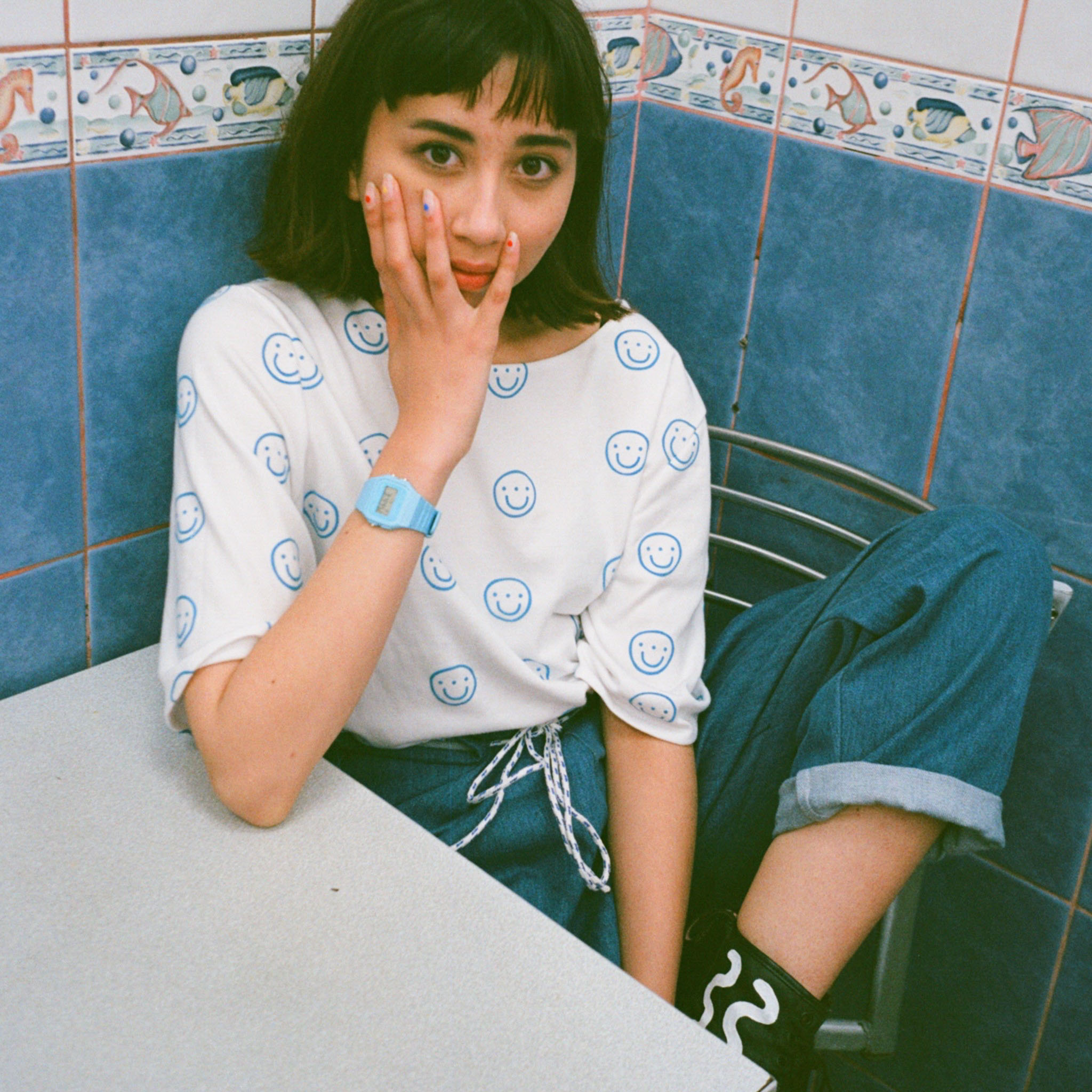 Flocked smiley face t-shirt, denim, and customised Dr. Martens. Photo taken by @bluelaybourne