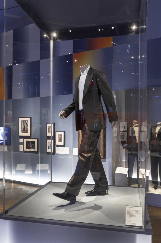 male mannequin in grey suit in striding pose