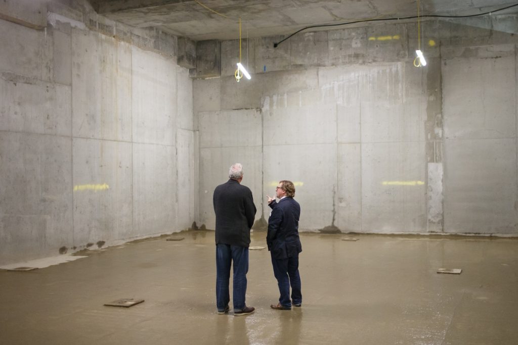 Pro Vice-Chancellor and Head of Camberwell, Chelsea and Wimbledon Chris Wainwright and Dean of Camberwell, Nick Gorse, admire the basement space that will house the new 262-seat lecture theatre for Camberwell.