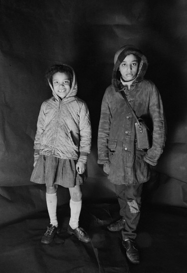 Portrait of Angela Loretta Lindsey, aged 8, with her brother Mark Emanuel Lindsey in Meadows's free photographic studio on Greame Street, Moss Side, Manchester, February - April 1972.