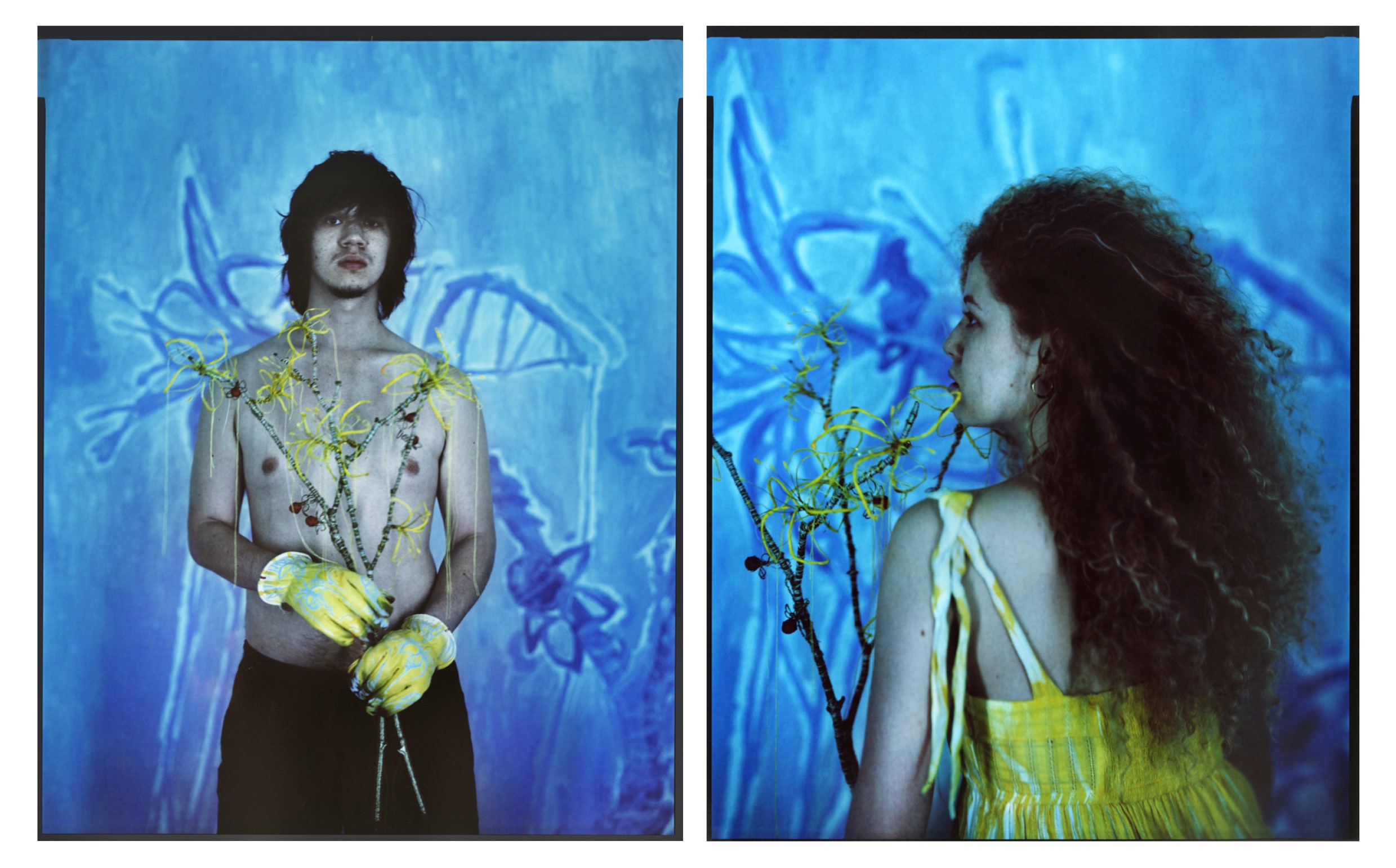 Model posed in front of printed fabric