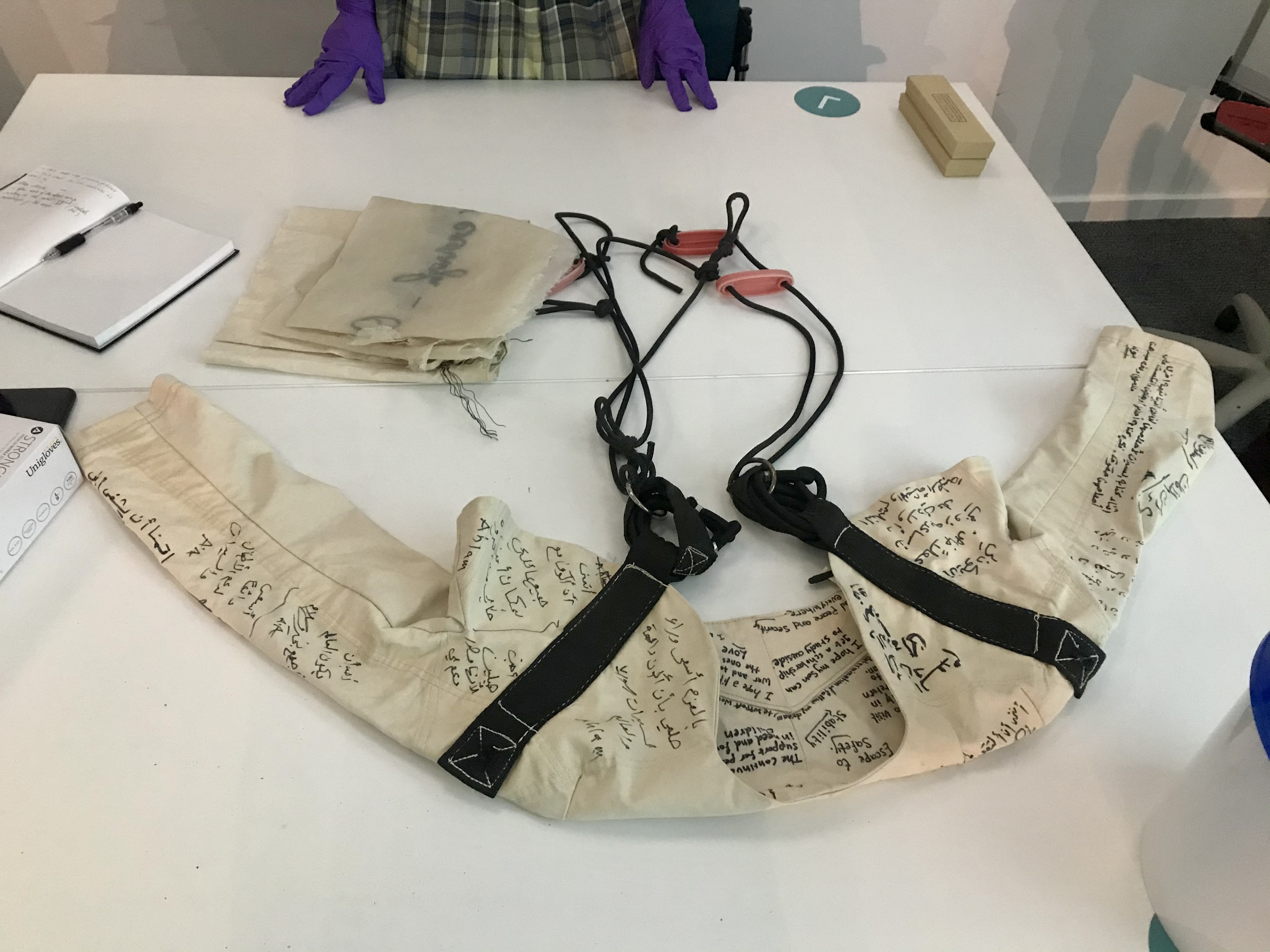 jacket with writing on it on table