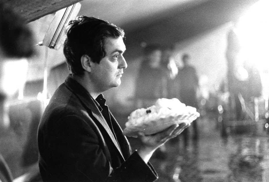 Stanley Kubrick on set during the deleted ‘Pie fight’ scene, c1963. 