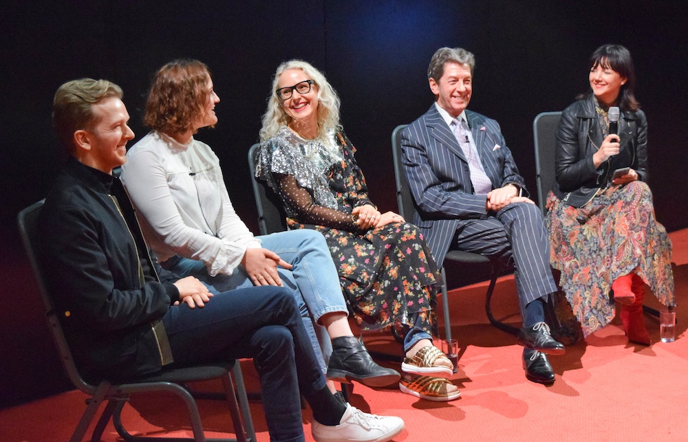 The EMBA panel discussing trends and consumer patterns in the industry. 