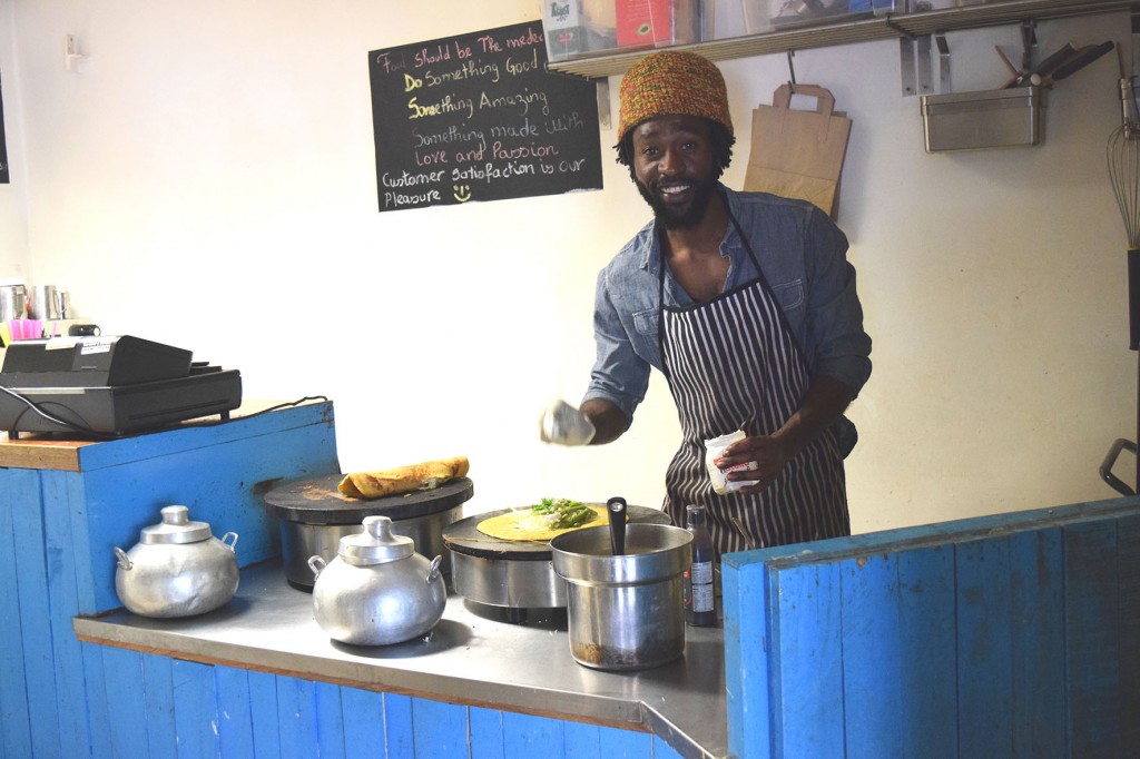 Photograph of one of the Maloko chefs making crepes in the kitchen