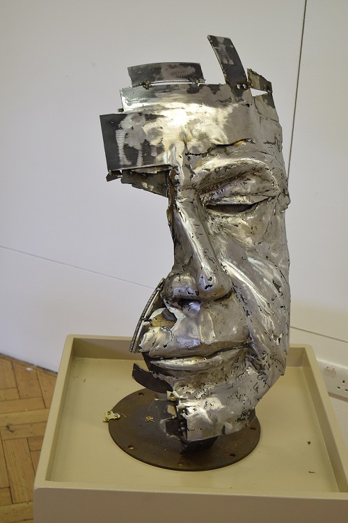 Metal portrait sculpture by Jack Lawrence - large scale metal sculpture of half of face