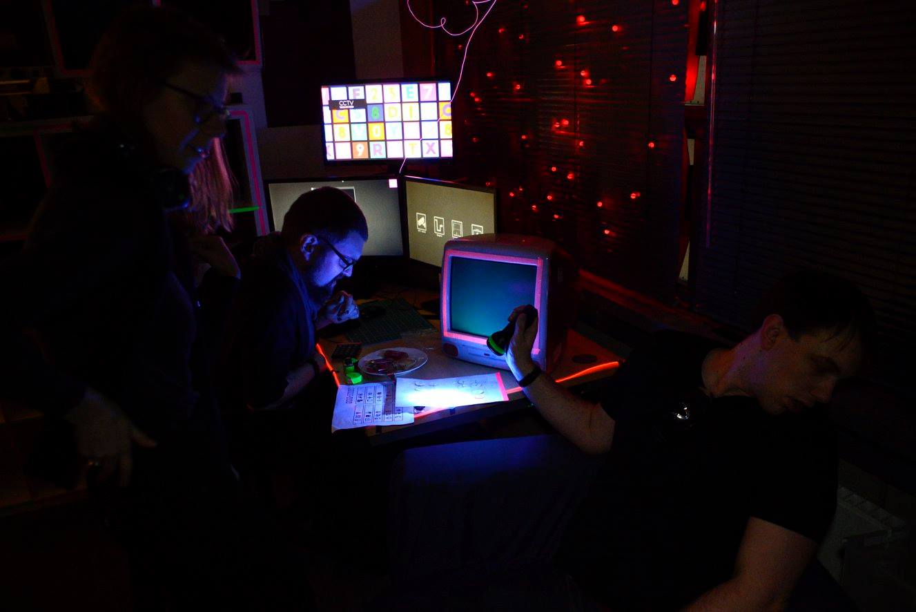 The players solving puzzles using the console