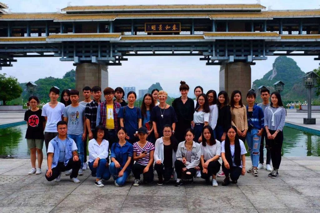 group of people with temple background