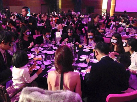 Alumni taking part in fundraising dinner