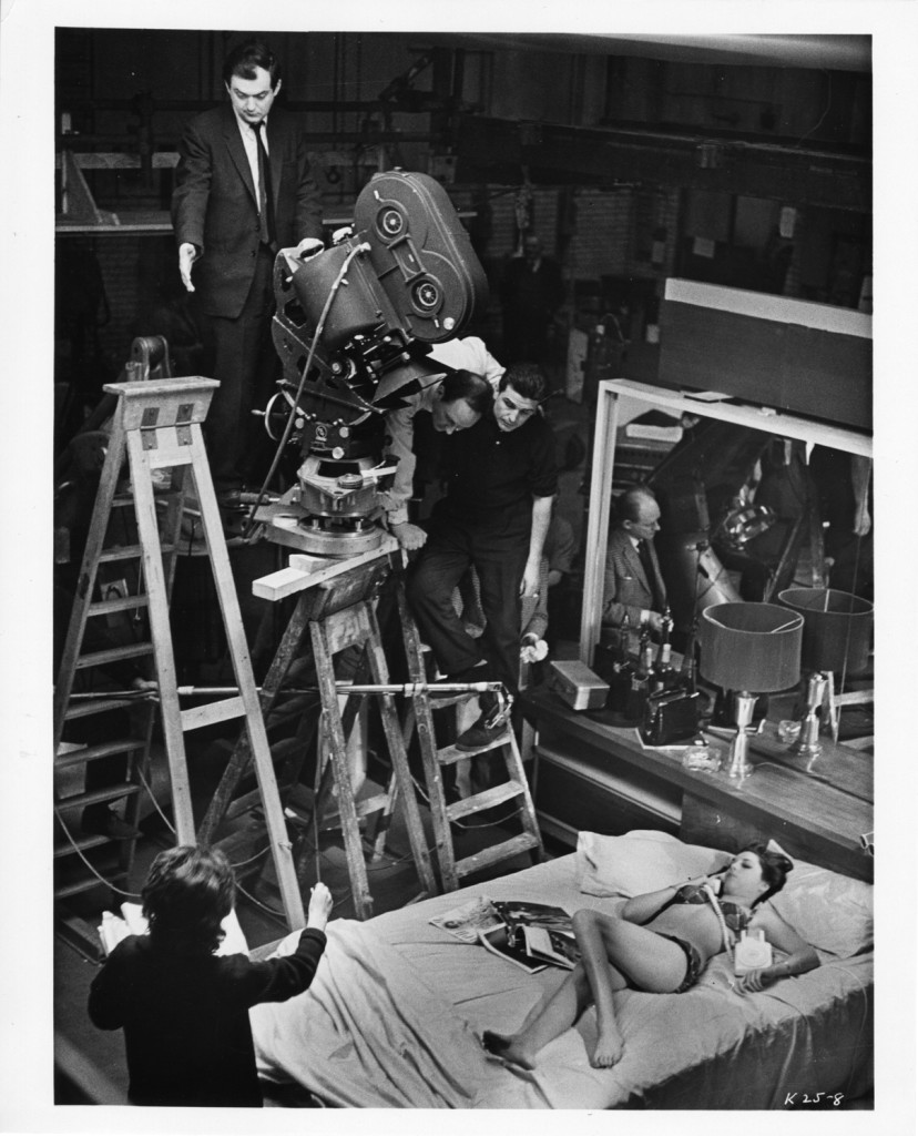 Kubrick with crew members and actress Tracey Scott on set, c1963