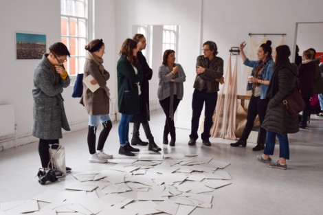 BA Fine Art Jeff Dennis tutor talking with students during a group crit