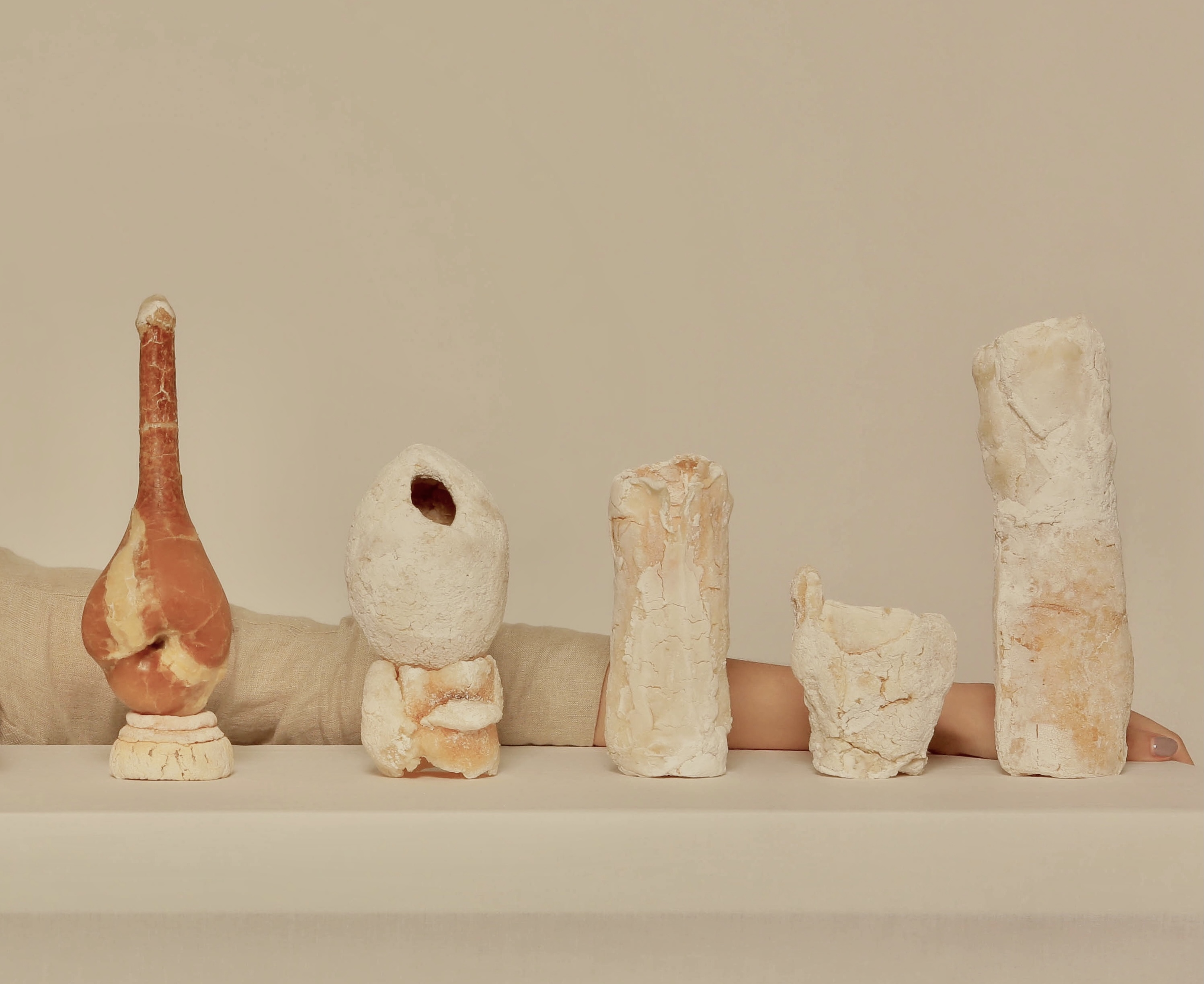Five clay vases in a row