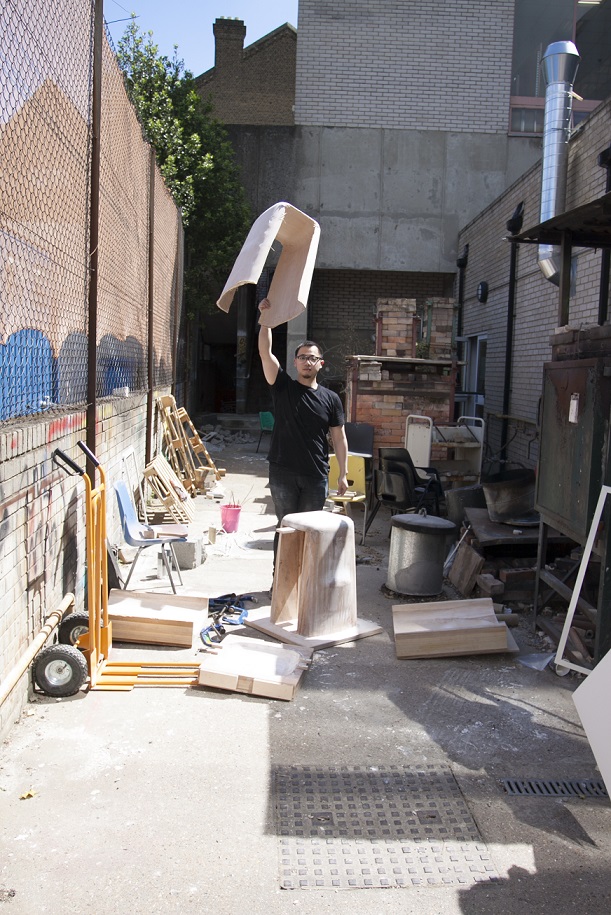 Mu Hau Kao creating his plywood stools outside the Camberwell workshops