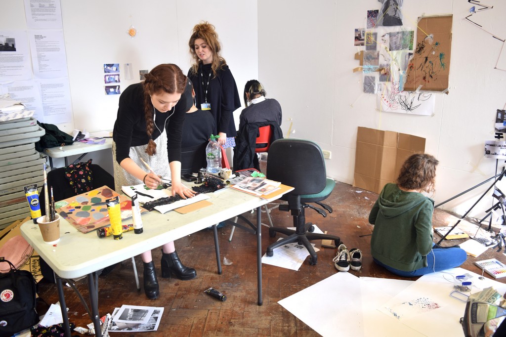 Foundation students working on a project exploring found objects and rules of making