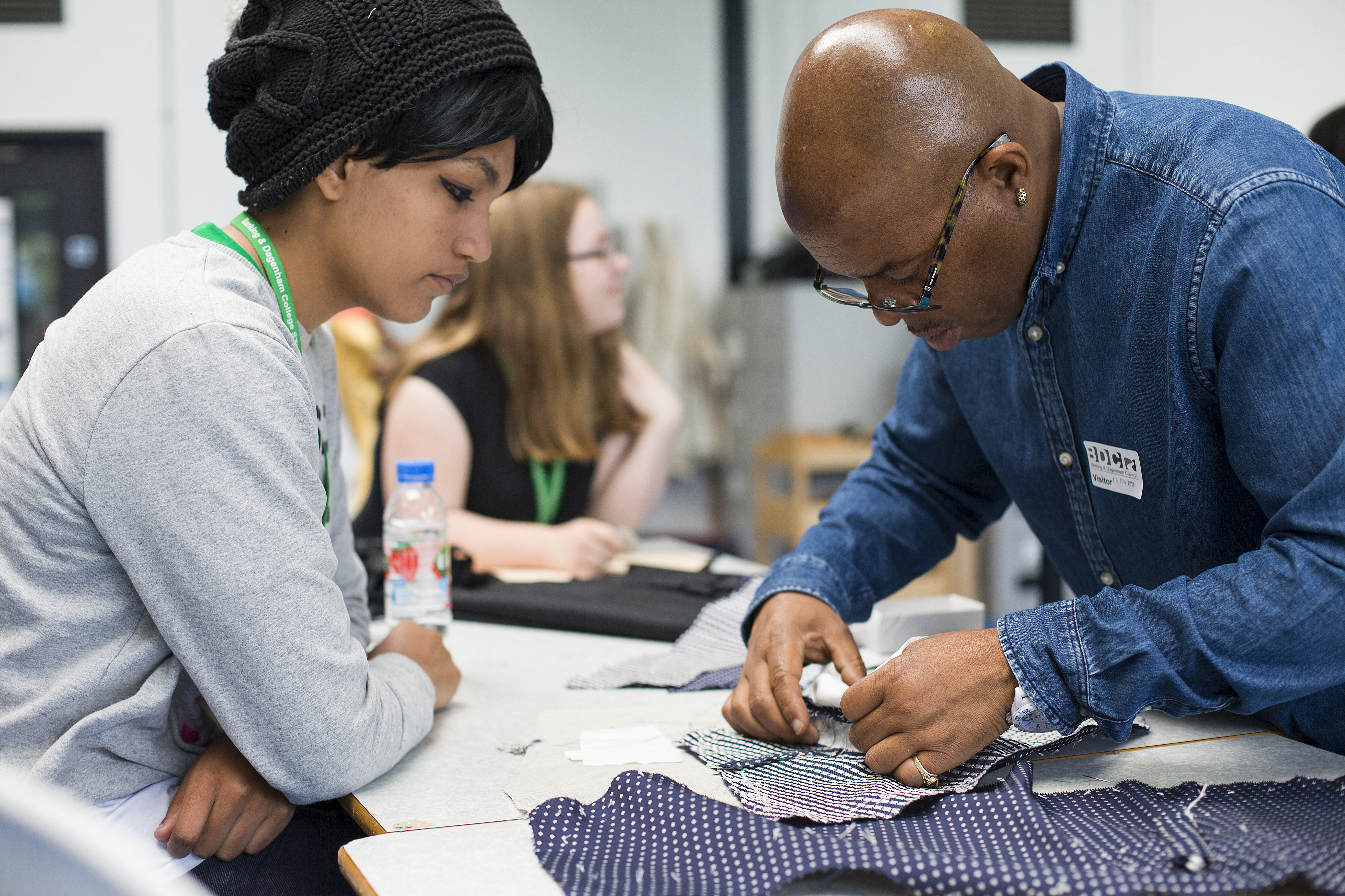 Winston Rose teaching the college students tailoring skills