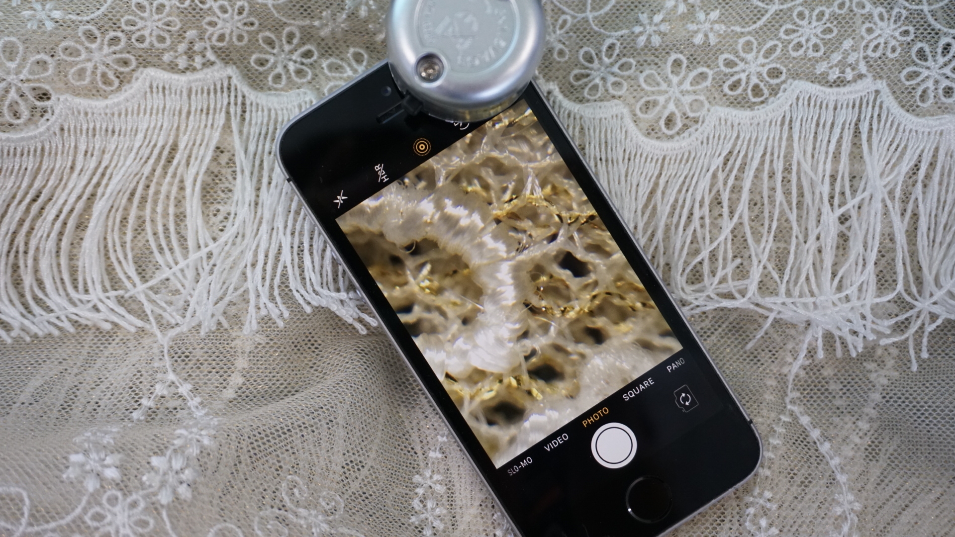 A microscopic view of an embroidered sample using a Phonescope 