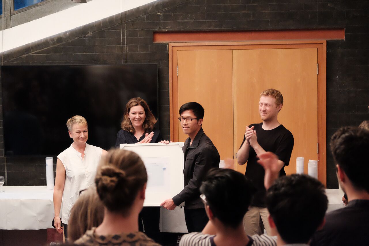 Chia-Lin Lin collecting his awards. 