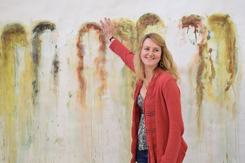 BA Painting student Damaris Athene holding her paint