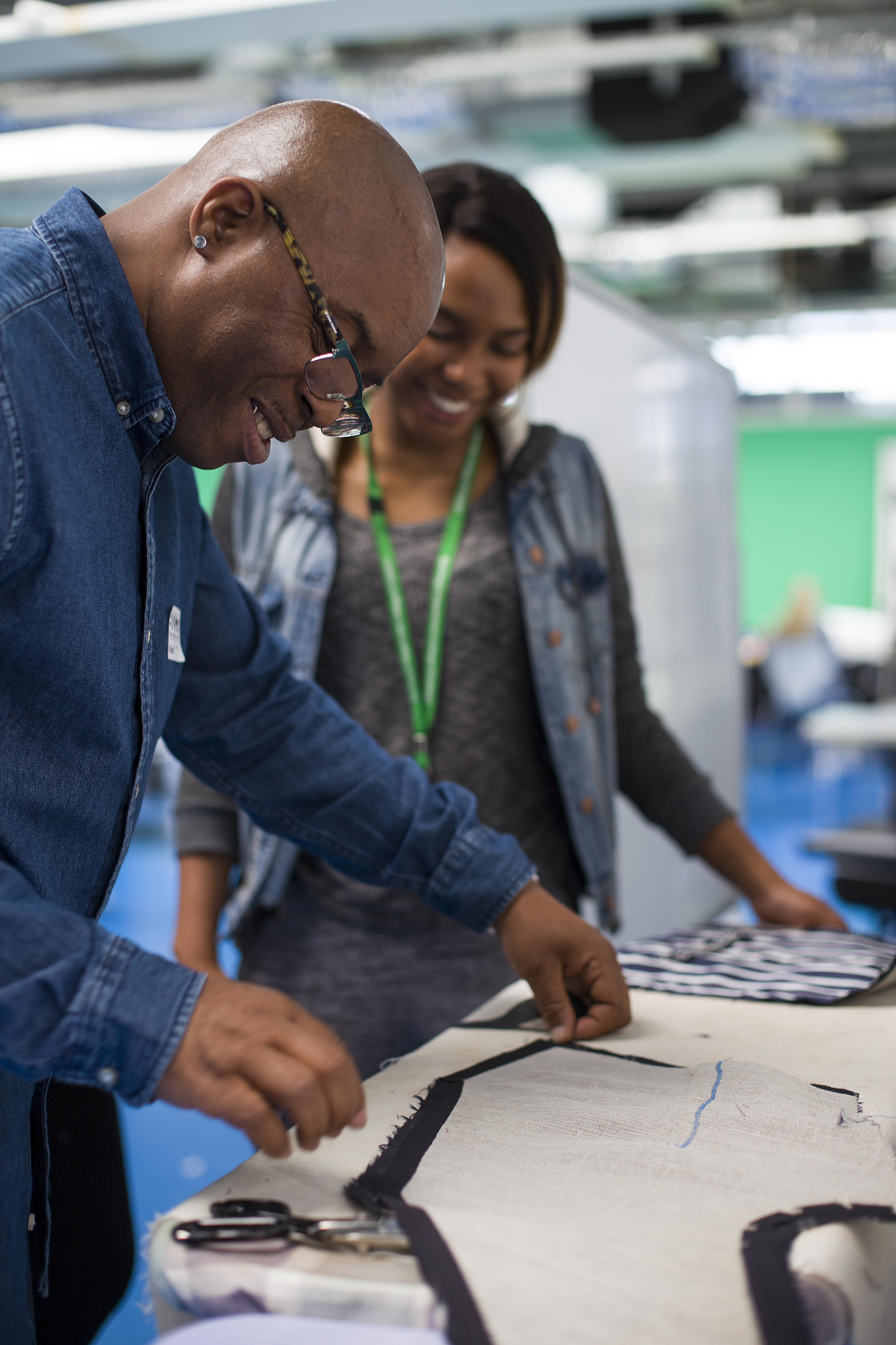 Winston Rose teaching the college students tailoring skills