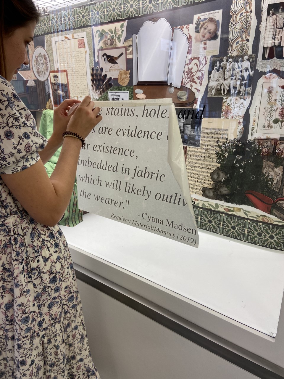 student holding text transfer against glass