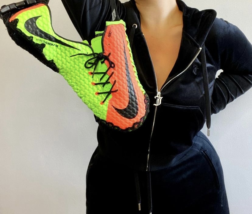 Volt and orange football boots reworked as a handbag