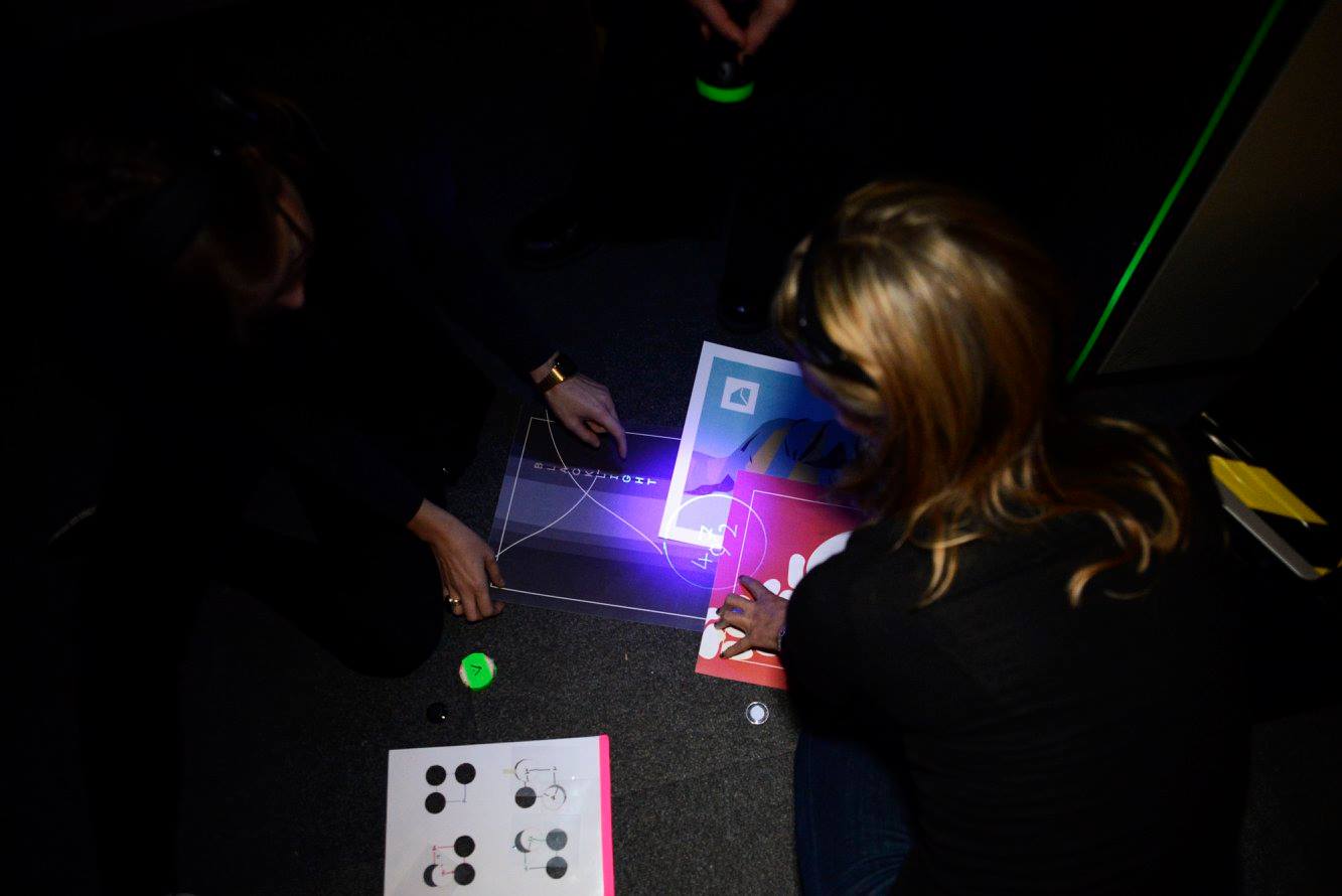 Using UV light, players have to piece together a pattern using objects found in the room