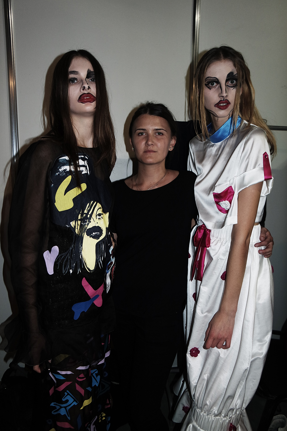 Alina Zamanova with two models during Ukraine Fashion Week 2015. 