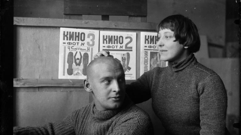 Credit: Michail Kaufman, A. Rodchenko and V. Stepanova in the workshop. (in front of Kino-phot magazine covers), 1923 Courtesy Rodchenko and Stepanova Archives, Moscow