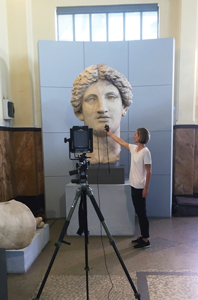 Photographing the Colossal statue of a female divinity at Centrale Montemartini, Rome, Sept 2016.