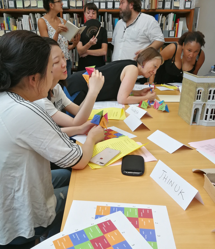 Workshop participants sit at a table