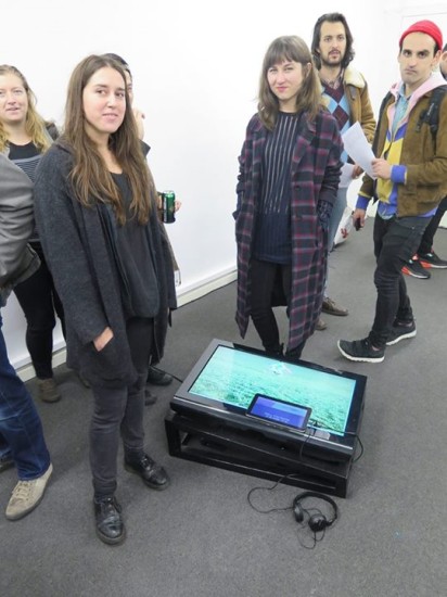 Sisters standing next to installation What would dad do Round 1-5